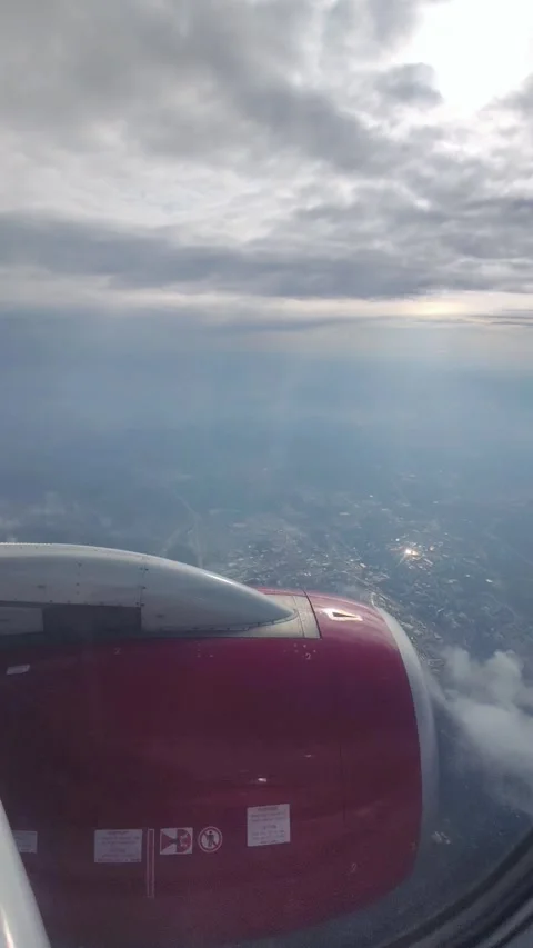 View of the blue sky above the clouds from the airplane window. Air travel. 库存影片 334366600