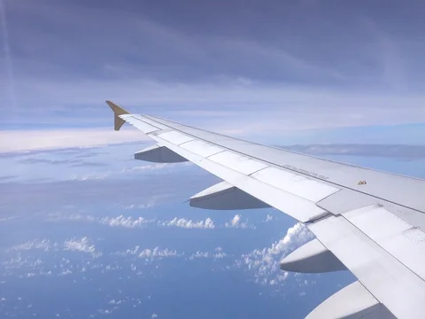 View of Blue sky and cloud out the window airplane wing, Cloudscape 库存影片 77679230