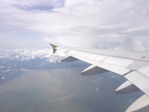 View of Blue sky and cloud out the window airplane wing, Cloudscape 库存影片 77679706