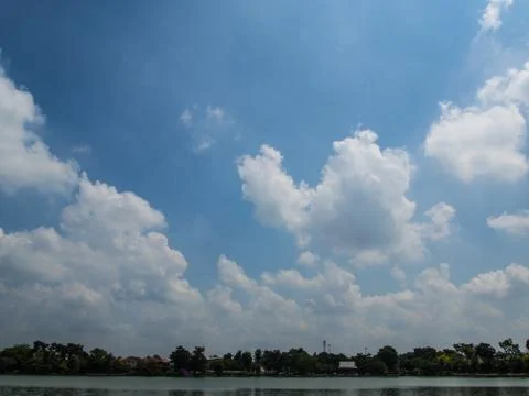 View of the blue sky with cloud over the lake Stock Photos