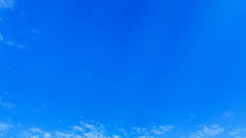 View of blue sky with few clouds Stock Photos