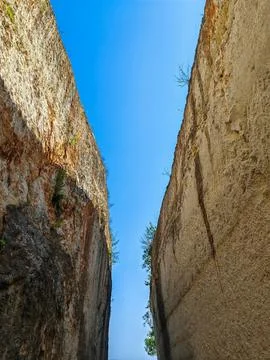 View of the blue sky, flanked by two steep cliffs Stock Photos