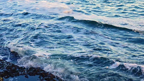View of the blue waves with foam on the sea Stock Footage 229895947
