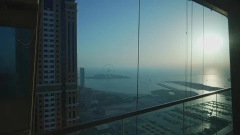 View of Bluewaters Dubai through a window from the Dubai Marina complex. The Stock Footage 279923863