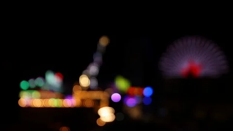 View of blurry colorful lights of fairground at night Stock Footage 124523927