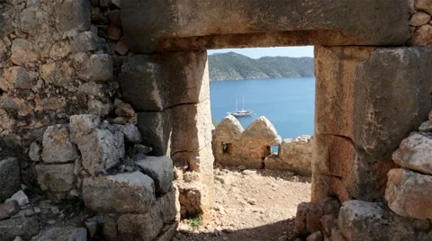 View at a boat in the bay through an old arc Stock Footage 60640611