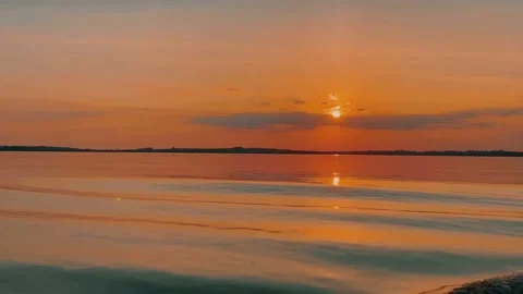 View from the boat to a beautiful red sunset on the lake Stock-Footage 211761325