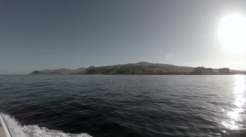 View from a boat looking towards the west side of Oahu in slow motion Stock Footage 49910802