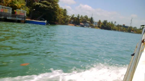 View from boat making waves travel on Kalu Ganga river in Sri Lanka Video stock 69066819