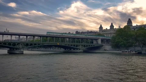 View From a Boat of a Metro passing on a Bridge over Paris River Stock Footage 233962499