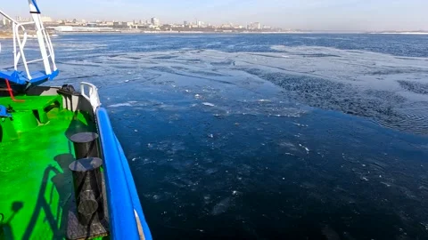 View of a boat moving on a winter river Stock Footage 306548445