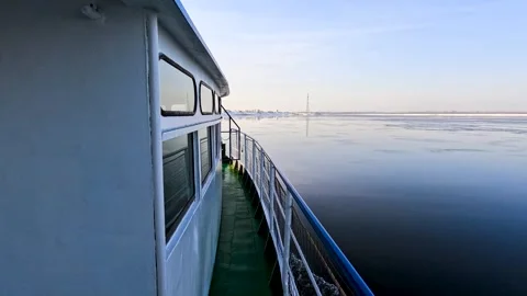View of a boat moving on a winter river Stock Footage 324854954