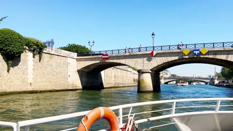 View from boat on Pont de Sully bridge by Notre Dame, Paris Stock Footage 220437715