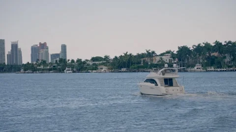 View of boat speeding across the Florida Intra Coastal Waterway Miami Beach Stock Footage 259769040