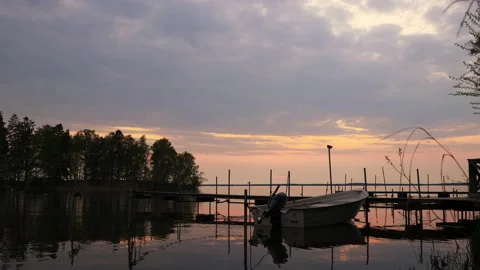 A view of boat in the stunning evening with sunset at beautiful lake Stock-Footage 170450787
