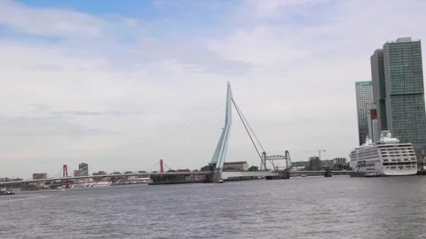 View from the boat towards the city with the Erasmus Bridge and a cruise ship Stock Footage 284720853