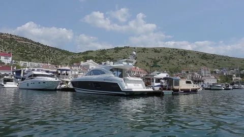 View from the boat on yahts in small sea city Stock Footage 76247364