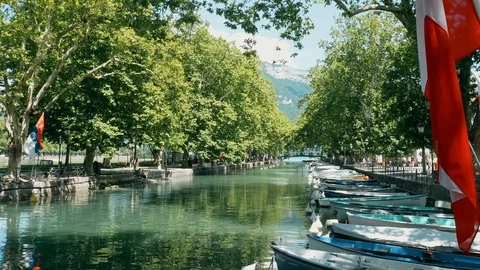 View on boats and flags at the lake in Annecy, France Stock Footage 91680894