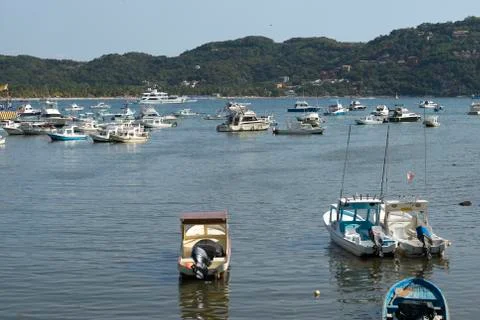 View of boats in an ocean inlet Stock Photos
