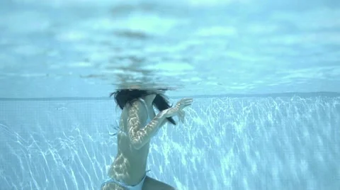 View of body under surface of water in pool Stock Footage 65754613
