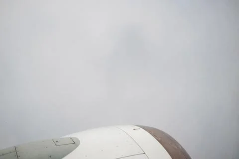 View from Boeing on On Thick Gray Clouds, Sky Is Not Visible. In frame White Stock Photos