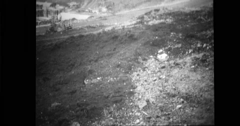 View of bomb hole and damaged truck at Dutch harbour after Japanese attack Stock Footage