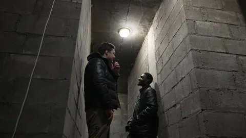 View of a bombproof shelter with the ceiling in the cobweb, caucasian guy and Stock Footage 171347713