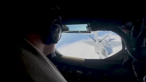 View from boom operators window of F-22 Ratpor approaching for aerial refuel Stock Footage 263036826