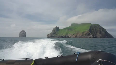A view of Boreray and Stac Lee from a speeding boat on a St Kilda day trip Stock Footage 229741311