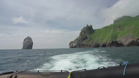 A view of Boreray and Stac Lee from the back of a St Kilda tourist boat Stock Footage 229759171