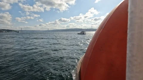 View of Bosphorus Bridge and Çamlıca Tower Framed by a Life Buoy on a Ferry Stock Footage 297775889