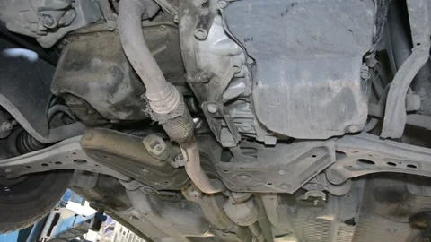View of the bottom of a car lifted by an elevator in a garage 스톡 동영상 133559225