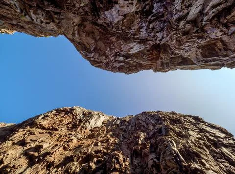 View from the bottom of deep river gorge. Stock Photos