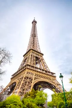 View from the bottom of The Eiffel Tower in Paris in cloudy day, France 스톡 사진