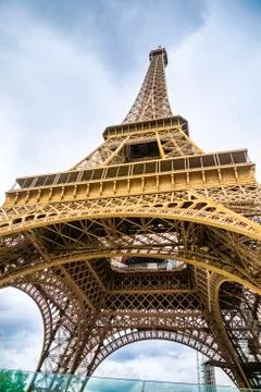 View from the bottom of The Eiffel Tower in Paris in cloudy day, France Foto stock