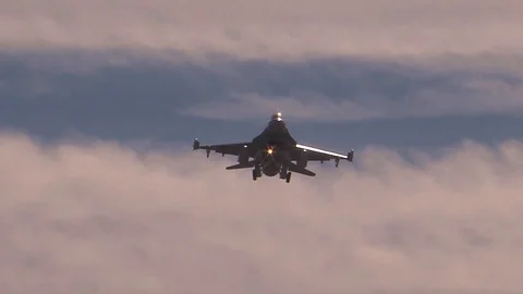View of the bottom of a F-16 Fighting Falcons in the sky Stock Footage 114083882