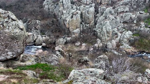 View of the bottom of the mountain canyon. A stream in a mountain valley. Stock Footage 152727618