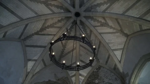 View from the bottom on the old chandelier in the form of a wheel with light Vídeo Stock 121693671