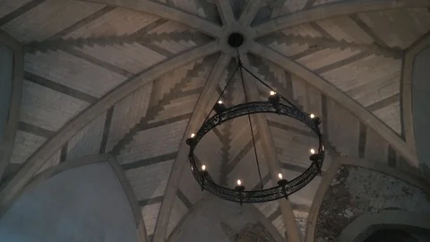 View from the bottom on the old chandelier in the form of a wheel with light Vídeo Stock 121693683