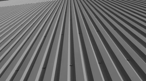 View from the bottom of a tall building of sheets of metal with vertical cutouts Stock Footage 125082537