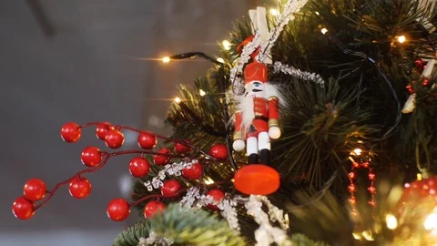View from the bottom of traditional nutcrackers figurine in red suit hanging on Stock Footage 108121509