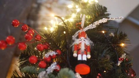 View from the bottom of traditional nutcrackers figurine in red suit hanging on Stock Footage 108121528
