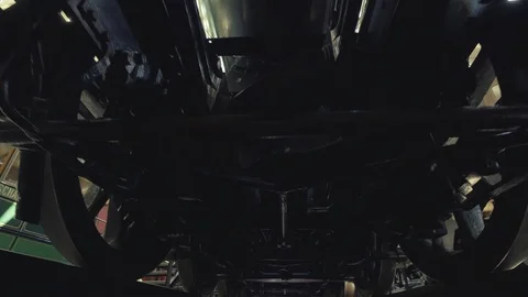 View of the bottom of train, a walk under the train. Steadicam shot Stock Footage 114901751