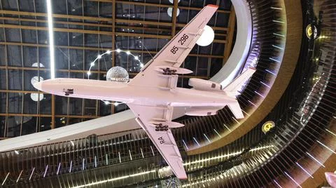 View from the bottom on the white airplane model hanging against the beautiful 스톡 사진