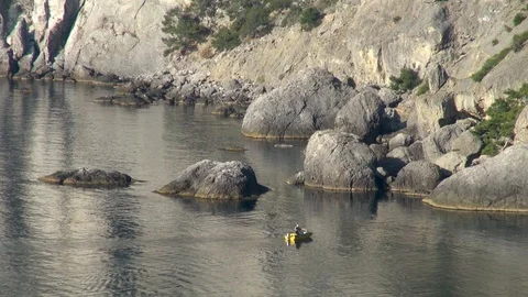 View of boulders emerging from waters of calm sea from Galitsyn trail. Stock Footage 108335162