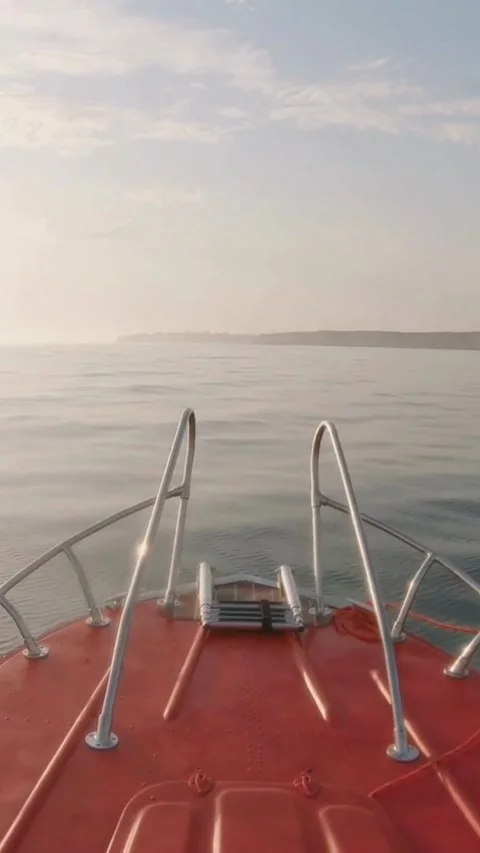 View from bow of red boat moving on water Video stock 334169063