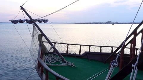 View of the bow of the ship with folded sails and a rope on the deck Stock Footage 114295350