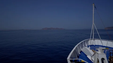 View of the bow of a ship headed toward an island. Stock Footage 93791181