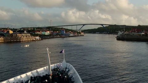 View of the bow of a ship as it enters the port of Willemstad Stock Footage 75931332