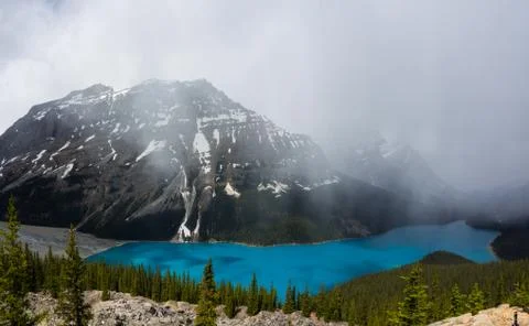 View from Bow Summit of Peyto lake with clouds in Banff National Park Stock Photos